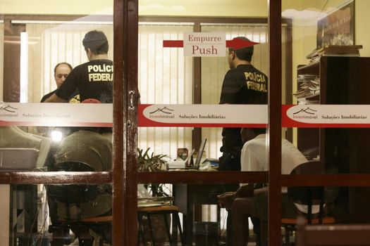 porto seguro, bahia / brazil - august 6, 2009: Federal Police agents are seen during an investigation operation in the city of Porto Seguro, in the south of Bahia.