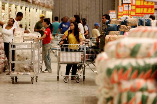 eunapolis, bahia / brazil - august 10, 2009: customers are seen pushing a shopping cart at the Atacadao supermarket in the city of Eunapolis, in southern Bahia.