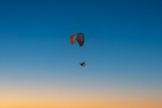 porto seguro, bahia, brazil -  may 8, 2008: Person flying with paramortor in the Trencoso region in southern Bahia.