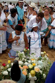 salvador, bahia, brazil - february 2, 2014: member of the candomble religion participates in a party in honor of Yemanja in the city of Salvador.