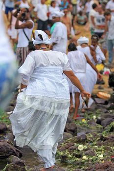 salvador, bahia, brazil - february 2, 2014: Integrants of the Candomble religion are seen during celebrations in honor of Orixa Yemanja on a beach in the city of Salvador.