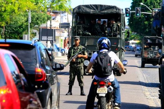 buerarema, bahia, brazil - february 14, 2014: Brazilian army soldiers patrol the streets of the city of Buerarema, during agrarian conflicts with Tupinamba Indians.
