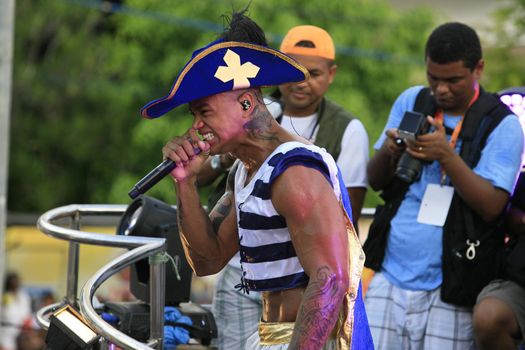 salvador, bahia, brazil - march 4, 2014: Singer Leo Santana performing in an electric trio during Carnival in the city of Salvador.