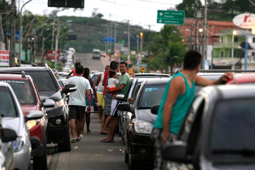 itaparica, bahia, brazil - june 24, 2014: vehicles queued to access the Ferry Boat system on the island of Itaparica bound for the city of Salvador.