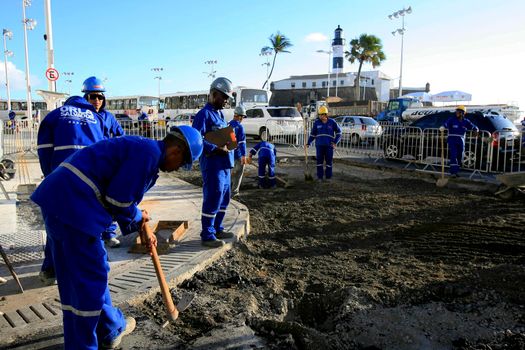 salvador, bahia / barazil - march 6, 2014: Workers are seen in revitalization works in the Barra neighborhood in the city of Salvador.



