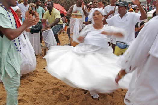 salvador, bahia, brazil - february 2, 2014: Integrants of the Candomble religion are seen during celebrations in honor of Orixa Yemanja on a beach in the city of Salvador.