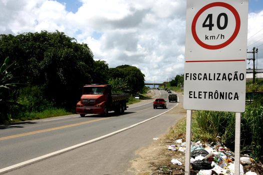 itabuna, bahia, brazil - january 13, 2012: traffic signs indicate speed limit to 40 kilometers per hour on federal highway BR 101 in the city.