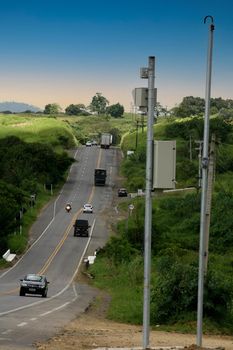 itabuna, bahia, brazil - january 13, 2012: vehicle traveling on federal highway BR 101 next to a speed surveillance radar in the city.