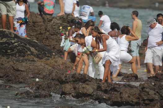 salvador, bahia, brazil - february 2, 2015: Candomble devotees and supporters of the African matriaz religion pay tribute to the orixa Yemanja in the city of Salvador.