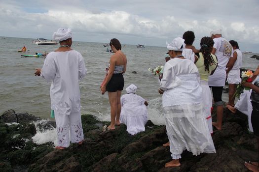 salvador, bahia, brazil - february 2, 2015: Candomble devotees and supporters of the African matriaz religion pay tribute to the orixa Yemanja in the city of Salvador.