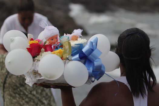 salvador, bahia, brazil - february 2, 2014: Integrants of the Candomble religion are seen during celebrations in honor of Orixa Yemanja on a beach in the city of Salvador.