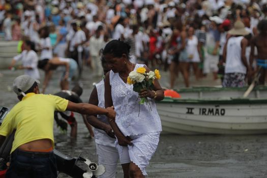 salvador, bahia, brazil - february 2, 2015: Candomble devotees and supporters of the African matriaz religion pay tribute to the orixa Yemanja in the city of Salvador.