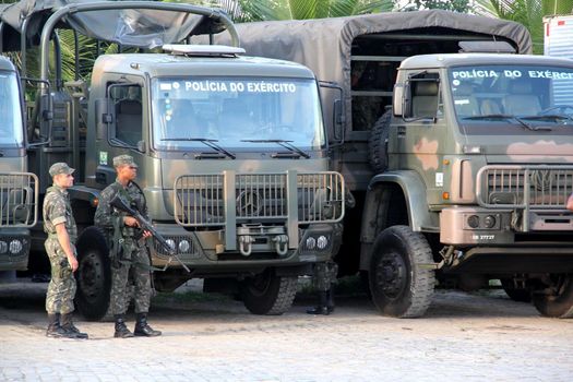 buerarema, bahia, brazil - february 14, 2014: Brazilian army soldiers patrol the streets of the city of Buerarema, during agrarian conflicts with Tupinamba Indians.