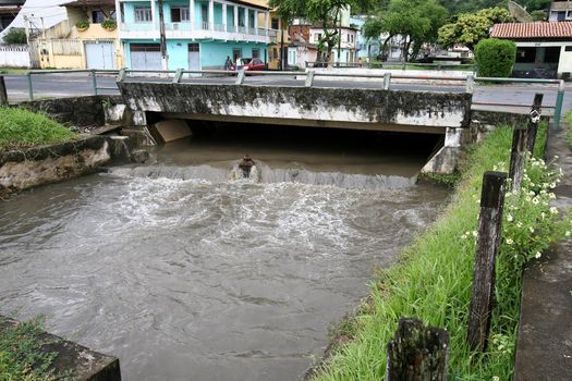 ilheus, bahia, brazil - march 5, 2012: water channel of a stream with polluted waters with domestic scum in the city of Ilheus.