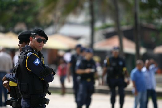 salvador, bahia, brazil - july 15, 2014: agents of the Municipal Guard do security during road restoration works in the neighborhood of Itapua in the city of Salvador.
