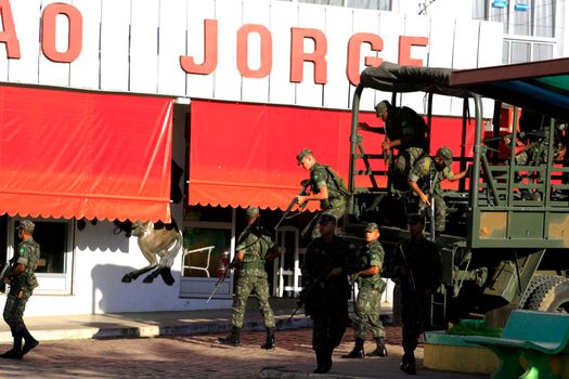 buerarema, bahia, brazil - february 14, 2014: Brazilian army soldiers patrol the streets of the city of Buerarema, during agrarian conflicts with Tupinamba Indians.
