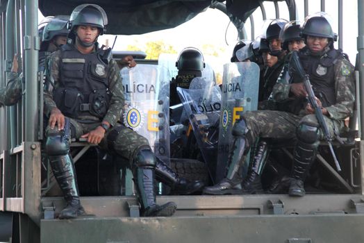 buerarema, bahia, brazil - february 14, 2014: Brazilian army soldiers patrol the streets of the city of Buerarema, during agrarian conflicts with Tupinamba Indians.