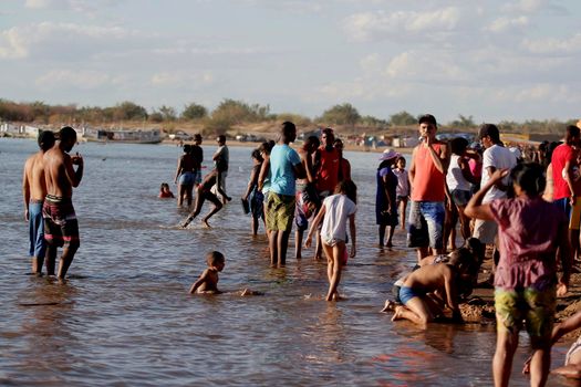 bom jesus da lapa, bahia, brazil - august 4, 2014: pilgrims are seen in the waters of the Sao Franciso river in the city of Bom Jesus da Lapa.