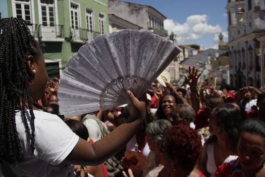 salvador, bahia, brazil - december 4, 2015: Santa Barbara devotees during Mass in Praised Santa at Largo do Pelourinho in Salvador city.