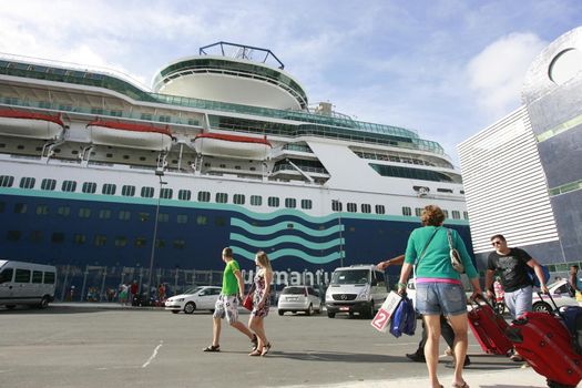 salvador, bahia, brazil - december 23, 2014: passengers during disembarkation from a transatlantic ship at the Maritime Terminal of Porto in the city of Salvador.