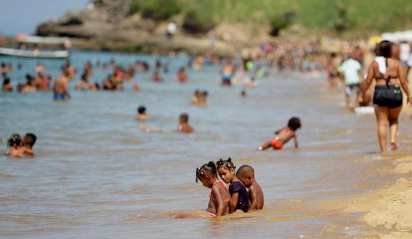 salvador, bahia / brazil - january 1, 2015: people are seen bathing on the Boa Viagem beach in the city of Salvador.