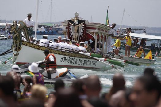 salvador, bahia, brazil - january 1, 2015: image of Bom Jesus dos Navegantes being carried by devotees on Boa Viagem beach after crossing the sea at Baia de Todos os Santos in Salvador.