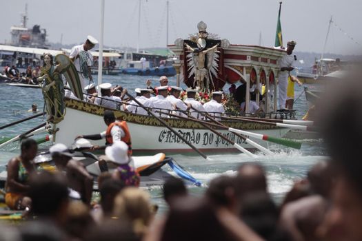 salvador, bahia, brazil - january 1, 2015: image of Bom Jesus dos Navegantes being carried by devotees on Boa Viagem beach after crossing the sea at Baia de Todos os Santos in Salvador.