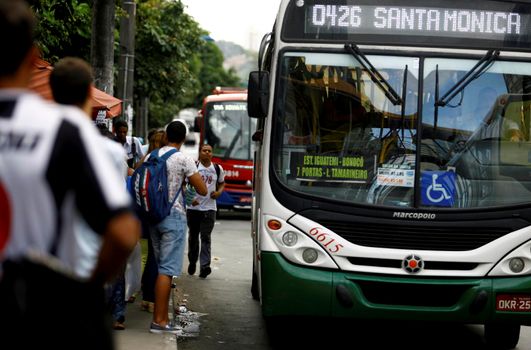 salvador, bahia, brazil - august 22, 2017: Passengers are seen in the public transport waiting at a bus stop on Avenida Tancredo Neves in Salvador.