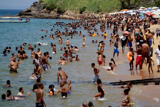 salvador, bahia / brazil - january 1, 2015: people are seen bathing on the Boa Viagem beach in the city of Salvador.