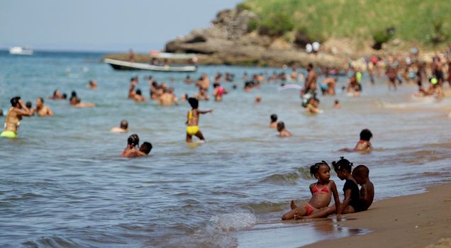 salvador, bahia / brazil - january 1, 2015: people are seen bathing on the Boa Viagem beach in the city of Salvador.