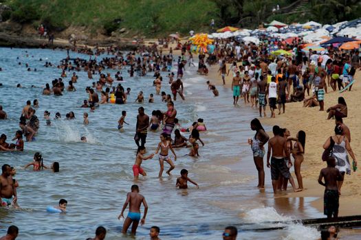 salvador, bahia / brazil - january 1, 2015: people are seen bathing on the Boa Viagem beach in the city of Salvador.