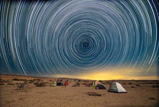 Summer tourism in a desert under Milky Way stars romantic