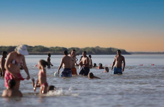 bom jesus da lapa, bahia, brazil - august 4, 2014: people are seen next to boats in the water of the Sao Francisco river in the city of Bom Jesus da Lapa.