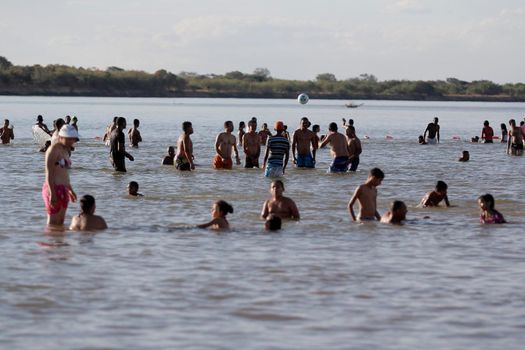 bom jesus da lapa, bahia, brazil - august 4, 2014: people are seen next to boats in the water of the Sao Francisco river in the city of Bom Jesus da Lapa.