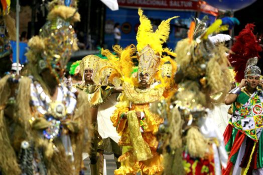 salvador, bahia / brazil - february 14, 2015: Members of the Afro Male DeBale block are seen in the Campo Grande neighborhood during Carnival celebrations in the city of Salvador.