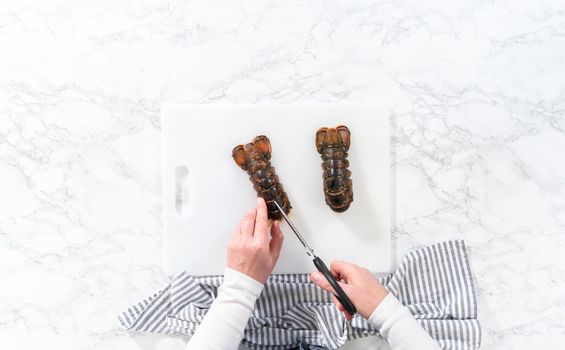 Flat lay. Preparing raw lobster tails to make garlic lobster tails.