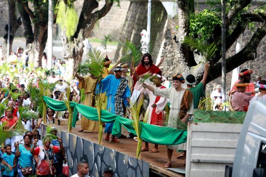 salvador, bahia, brazil - march 29, 2015: Catholics are seen carrying palm branches during procession of branches in Salvador city.