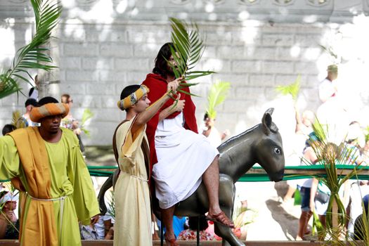 salvador, bahia, brazil - march 29, 2015: Catholics are seen carrying palm branches during procession of branches in Salvador city.