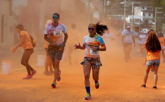 salvador, bahia / brazil - March 22, 2015: People are spotted during The Color Run street race at the Torroro Dike in Salvador.