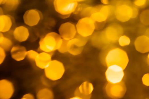 Golden Christmas lights, New Years Eve fireworks and abstract texture concept - Glamorous gold shiny glow and glitter, luxury holiday background