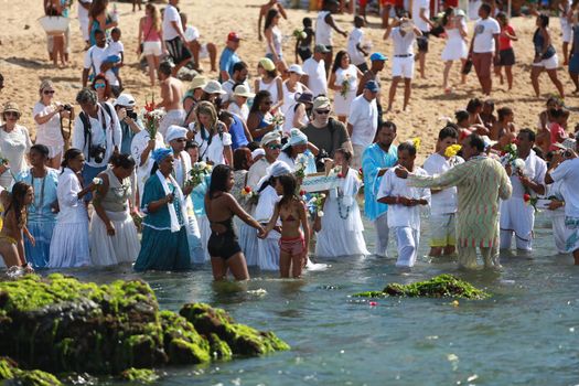 salvador, bahia, brazil - february 2, 2015: Candomble devotees and supporters of the African matriaz religion pay tribute to the orixa Yemanja in the city of Salvador.