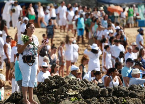 salvador, bahia, brazil - february 2, 2015: Candomble devotees and supporters of the African matriaz religion pay tribute to the orixa Yemanja in the city of Salvador.