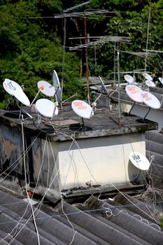 salvador, bahia / brazil - june 8, 2015: Subscription TV antennas are seen on a rooftop of residential building in the Paralela neighborhood of Salvador.