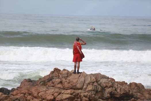 salvador, bahia / brazil - june 9, 2015: Members of the Bahia Fire Department are spotted astonishing missing persons at Stela Mares Beach in Salvador.