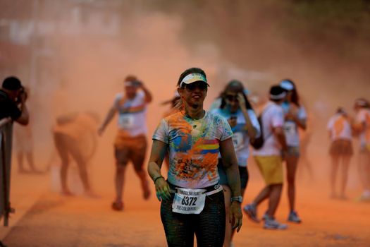 salvador, bahia / brazil - March 22, 2015: People are spotted during The Color Run street race at the Torroro Dike in Salvador.