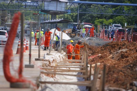 salvador, bahia / brazil - may 6, 2015: Workers work together to traffic vehicles on Avenida Antonio Carlos Magalhaes in works to expand the subway of Salvador.