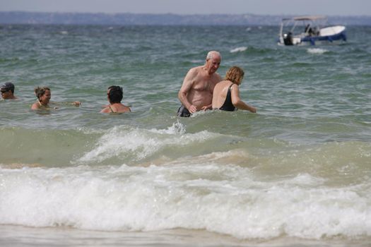 salvador, bahia / brazil - june 12, 2015: People are seen on the Nossa Senhora de Gaudalupe beach on Frades Island in th city of Salvador.