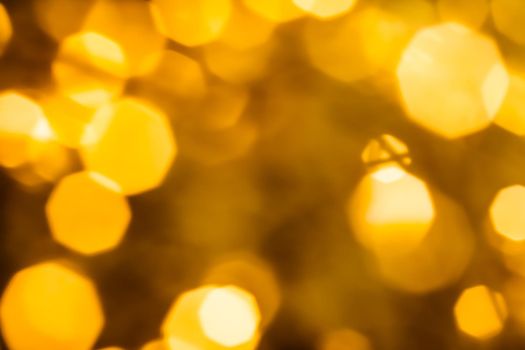 Golden Christmas lights, New Years Eve fireworks and abstract texture concept - Glamorous gold shiny glow and glitter, luxury holiday background