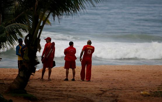 salvador, bahia / brazil - june 9, 2015: Members of the Bahia Fire Department are spotted astonishing missing persons at Stela Mares Beach in Salvador.