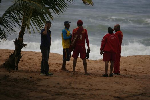 salvador, bahia / brazil - june 9, 2015: Members of the Bahia Fire Department are spotted astonishing missing persons at Stela Mares Beach in Salvador.